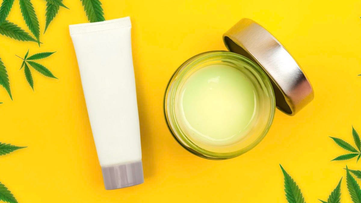 CBD cream and salve in hemp green background